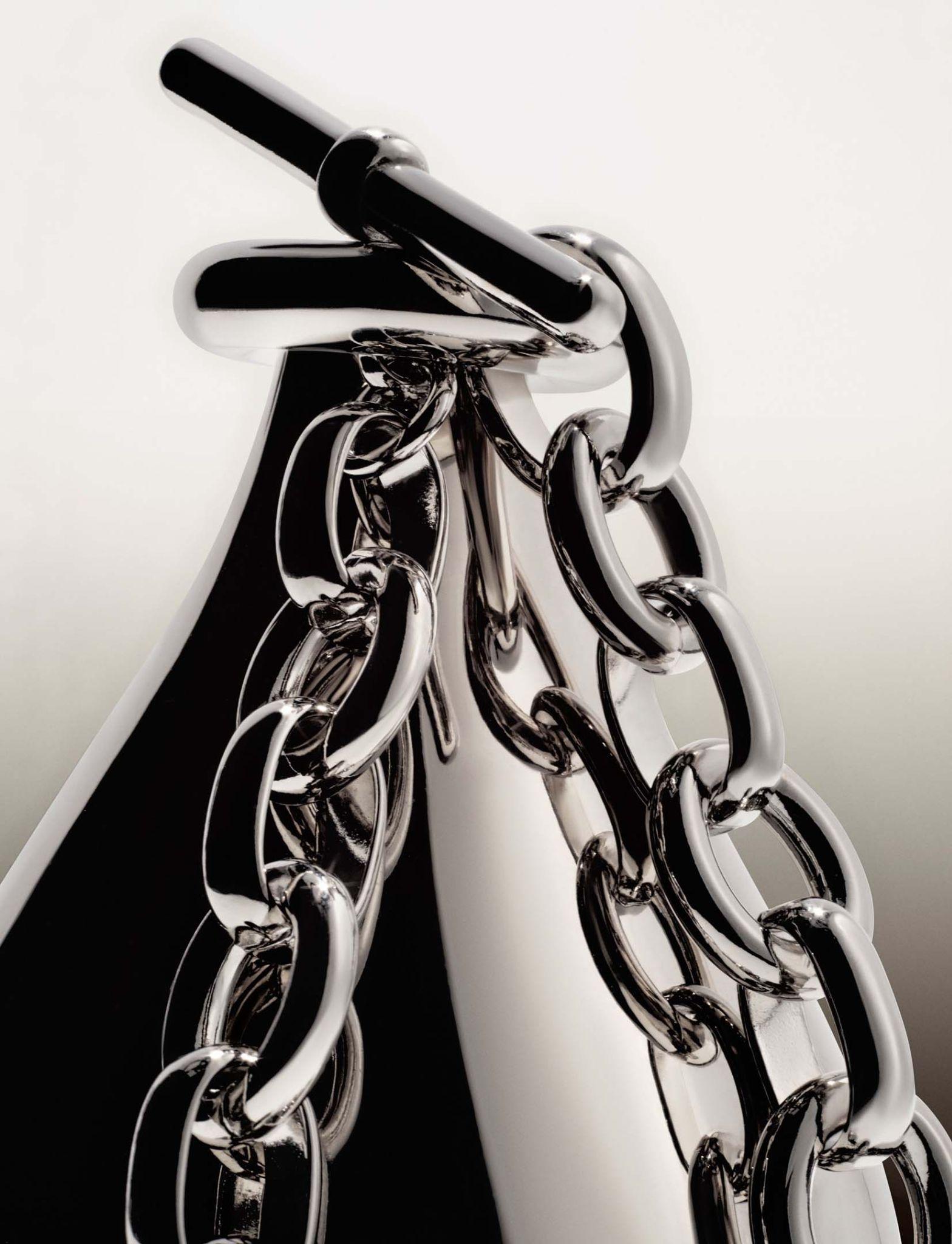 Chrome chain macro on a soft gradient